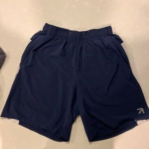 New Balance running shorts with a supporting liner (mid thigh length)